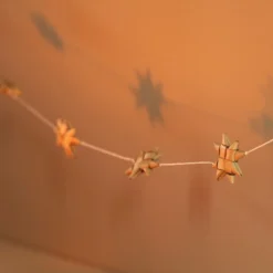 Afroart Natural Stars On A String Garland -Jellycat Christmas Store afroart natural stars string garland 0v8a7509 900x900 1