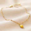 Enamel Lemon Charm Anklet In Gold 2 Enamel Lemon Charm Anklet In Gold -Jellycat Christmas Store enamel lemon charm anklet gold 4x3a6634 900x900 1