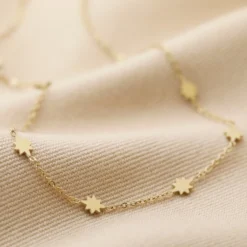 Gold Stainless Steel Long Starry Necklace 9 Gold Stainless Steel Long Starry Necklace -Jellycat Christmas Store long tiny star necklace in gold 4x3a7116 copy 900x900 1