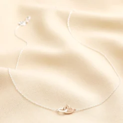 Mixed Metal Tiny Interlocking Hearts Necklace In Silver -Jellycat Christmas Store mixed metal tiny interlocking hearts neacklace silver 4x3a3840 900x900 1