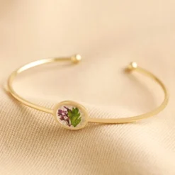 Pressed Birth Flower Bangle In Gold -Jellycat Christmas Store pressed birth flower bangle gold february 0v8a5339 900x900 1