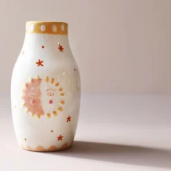 Sun And Moon Face Ceramic Posy Vase, H13.5cm 12 Sun And Moon Face Ceramic Posy Vase, H13.5cm -Jellycat Christmas Store sun moon face ceramic posy vase 4x3a1520 900x900 1