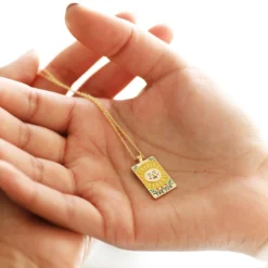 Enamel The Sun Tarot Card Necklace In Gold -Jellycat Christmas Store the sun tarot enamel pendant necklace gold 4x3a7924 900x900 1