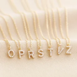 Tiny Pearl Initial Charm Necklace In Gold -Jellycat Christmas Store tiny pearl initial charm necklace gold 0v8a5000 900x900 1