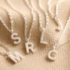Tiny Pearl Initial Charm Necklace In Silver -Jellycat Christmas Store tiny pearl initial charm necklace silver 0v8a5374 900x900 1