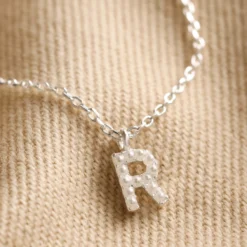 Tiny Pearl Initial Charm Necklace In Silver -Jellycat Christmas Store tiny pearl initial charm necklace silver 0v8a5378 2 900x900 1