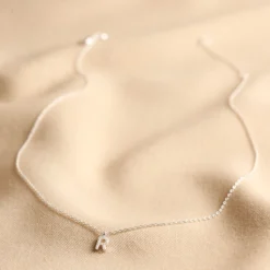 Tiny Pearl Initial Charm Necklace In Silver -Jellycat Christmas Store tiny pearl initial charm necklace silver 0v8a5392 2 900x900 1